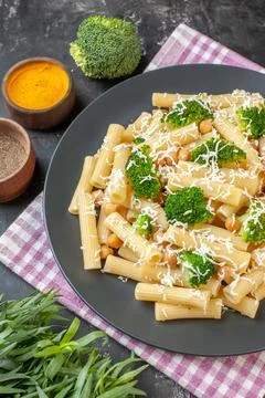Top view delicious cooked pasta with broccoli and seasonings on light-gray .. Stock Photos