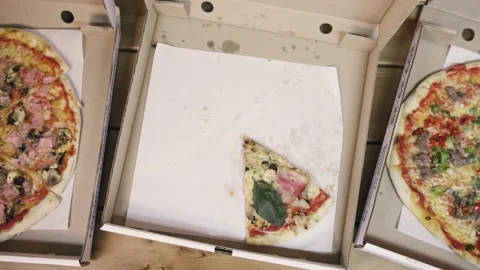 Top view of delivering a pizza box. Pizza slices disappear. Stop motion Video stock 278026973