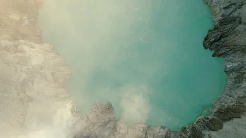 Top view of descent get down into crater to the acid lake in active Ijen volcano Stock Footage 269111909