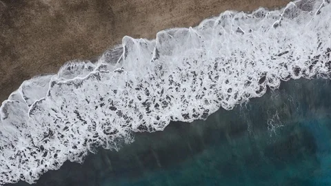 Top view of the desert black beach on the Atlantic Ocean. Coast of the island of Video stock 113605881