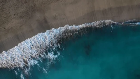 Top view of the desert black beach on the Atlantic Ocean. Coast of the island of Stock Footage 120757361