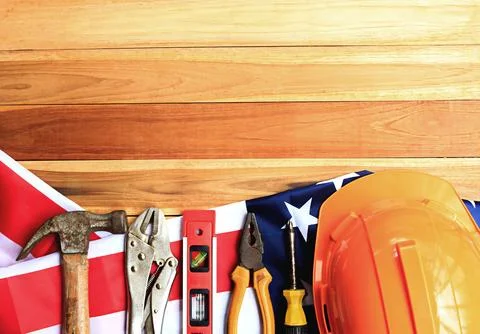 Top view design concept of Labor Day with working tools. Stock Photos
