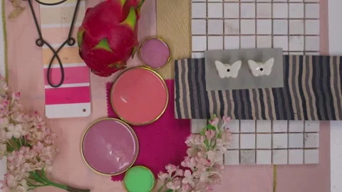 Top view of designer creating moodboard with fabric samples and flowers Stock Footage 330809235