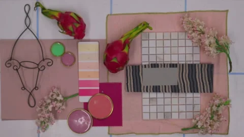 Top view of designer creating moodboard with fabric samples and flowers Stock Footage 330809408