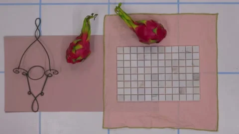 Top view of designer creating moodboard with fabric samples and flowers Stock Footage 330809476