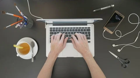 Top view of desk. Man typing on his laptop. Stock Footage 81801105