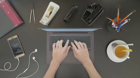 Top view of desk. Man typing on his laptop. Stock Footage 81802119