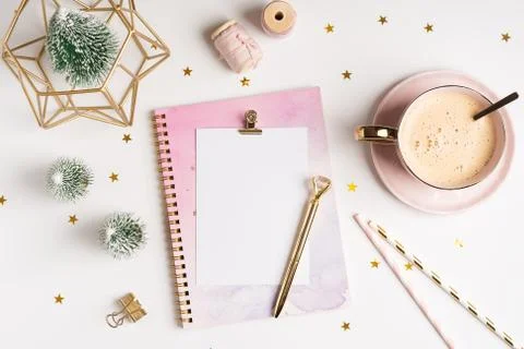 Top view of Desktop blank note pad with cup of coffee and Christmas decoratio Stock Photos