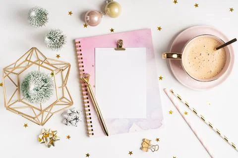 Top view of Desktop blank note pad with cup of coffee and Christmas decoration Stock Photos