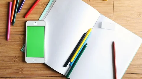 Top view of desktop with blank paper sheets stationery and smartphone with empty 스톡 동영상 89773582