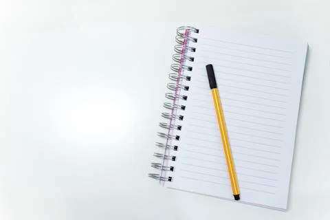 Top view of desktop with a notebook. White background Stock Photos