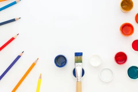 Top view of the desktop. A set of brushes and paints of the artist's student. Stock Photos