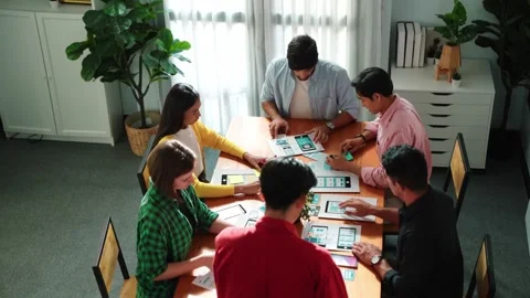 Top view of developer team designing Ux Ui design for mobile phone. Convocation. Stock Footage 271584779