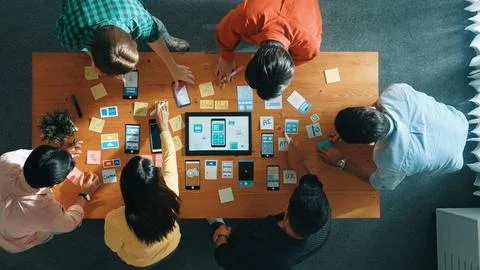 Top view of developer team working together to write idea on board. Convocation. Stock Photos
