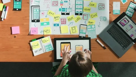 Top view of developer working on tablet and writing Ux Ui design. Convocation. Stock Footage 270434714