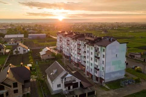 Top view of developing city landscape. Apartment building and suburb house ro Stock Photos