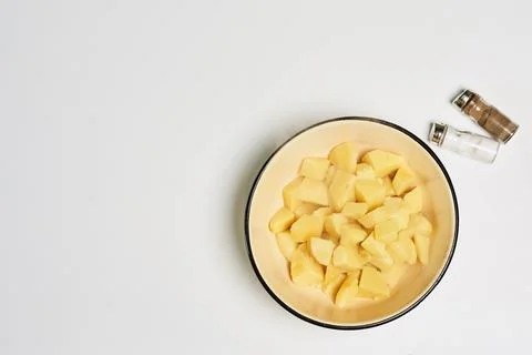 A top view of diced pumpkin pulp and seasonings on a white background - copy  Stock Photos
