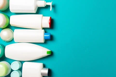 Top view of different cosmetic bottles and container for cosmetics on color.. Stock Photos