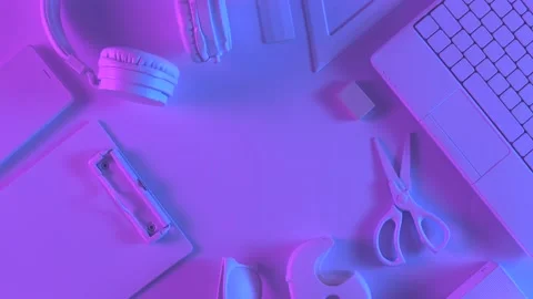 Top view of different stationery in vibrant gradient holographic neon colors 스톡 동영상 201193703