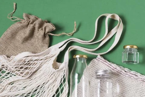 Top view different zero waste products green background. High quality and Stock Photos