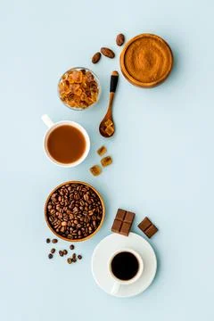 Top view of diffetent varieties of coffee beans with hot drink, top view Stock Photos