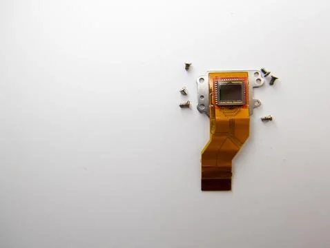 Top view of a digital camera sensor and screws around, concept of technology Stock Photos