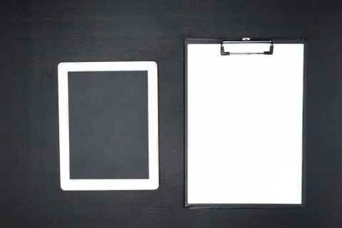 Top view of digital tablet with blank screen and clipboard isolated on grey Stock Photos