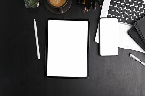 Top view of digital tablet, mobile phone, laptop computer and office supplies Stock Photos