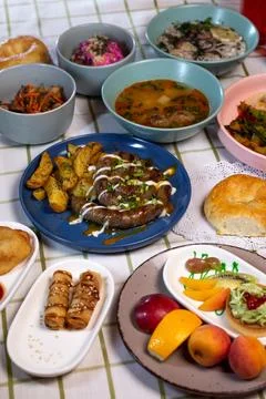 Top view of the dining table with delicious dishes served in a cafe or rest.. Stock Photos