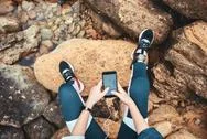 Top View Of Disabled Woman In Sport Wear With Leg Prosthesis Sitting On The Stock Photos