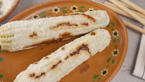 Top view of a dish known in Mexico as elote prepared on a clay plate Stock Footage 280316837