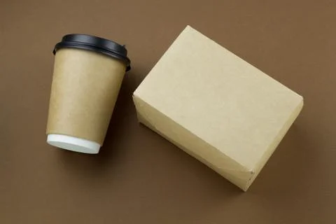 Top view disposable paper cup with plastic lid and cardboard box mock up on b Stock Photos