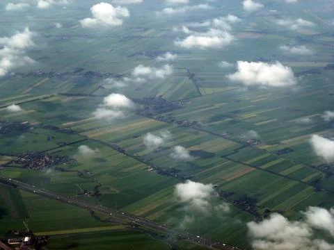 Top view of distant land surface with fields road and small settlements Stock Photos