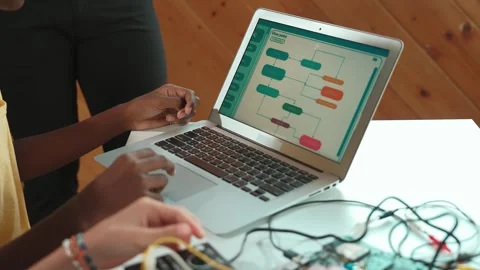 Top view of diverse smart children working together coding program. Edification Stock Footage 270087703