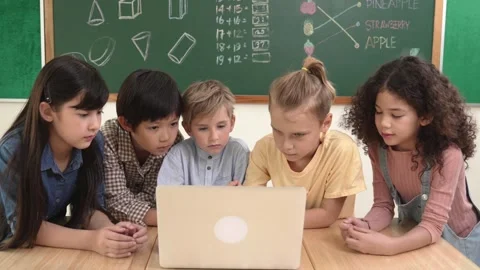 Top view diverse student looking at laptop and learning about code. Pedagogy. Stock Footage 281682876
