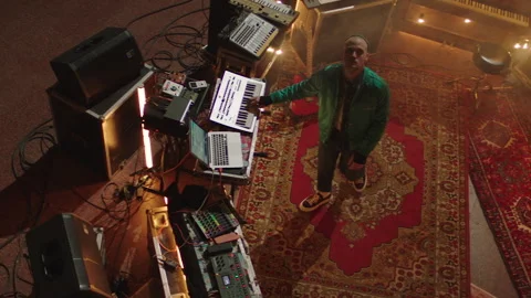 Top view of a DJ setup in a church and a DJ in the middle playing instruments Stock Footage 283258166