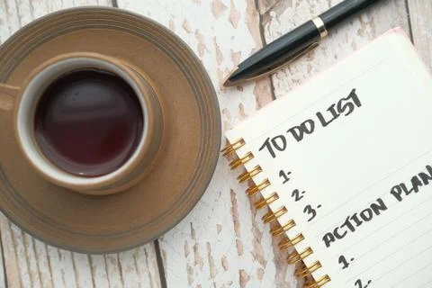 Top view of to do list and tea on table Stock Photos
