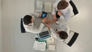 Top View Of Doctors Looking At Xray On Tablet Stock Footage