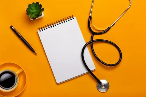 Top view of a doctor's table with notepad and pen stethoscope, keyboard, pres Foto stock