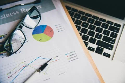 Top view with document Book Pen Graph laptop And accounting documents placed Stock Photos