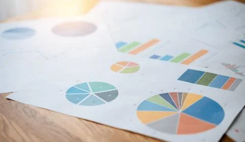 Top view documents with analytics data on table Stock Photos