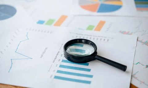 Top view documents with analytics data on table Stock Photos