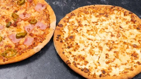 Top view dolly footage on three different type of pizza Stock Footage 84785824