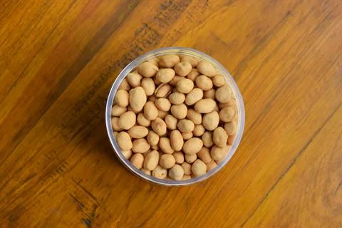 Top view of Dried atomic beans in food storage or jar on wooden table Stock Photos
