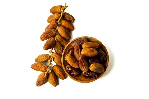 Top view of dried dates served on a wooden isolated on white background Foto stock