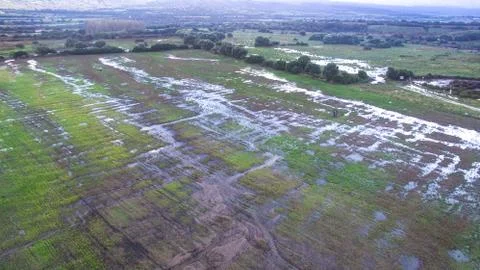 Top view with the drone of flooded fields and river overflowed after a severe Stock-Fotos