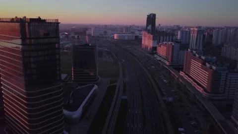 Top view drone flyes up on flying above city streets on early sunrise in Minsk Stock Footage 135062076