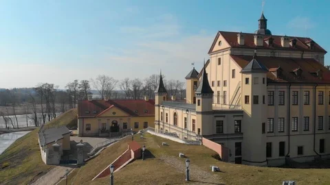 Top view from Drone flying over the old beautiful yellow and brown castle Stock Footage 126829472