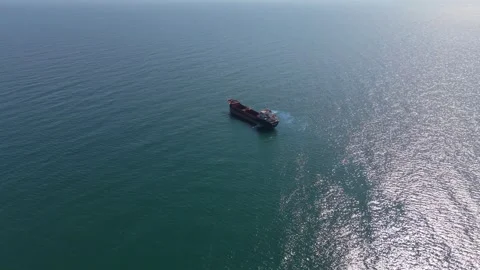 Top View Drone Footage Of Cargo Ship Moving Across Sea Vidéo 331234922