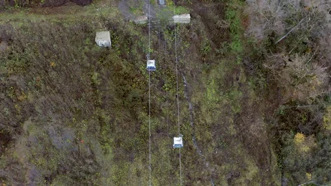 Top view from drone mountain elevator driving on cable way on hill background Video stock 99111164